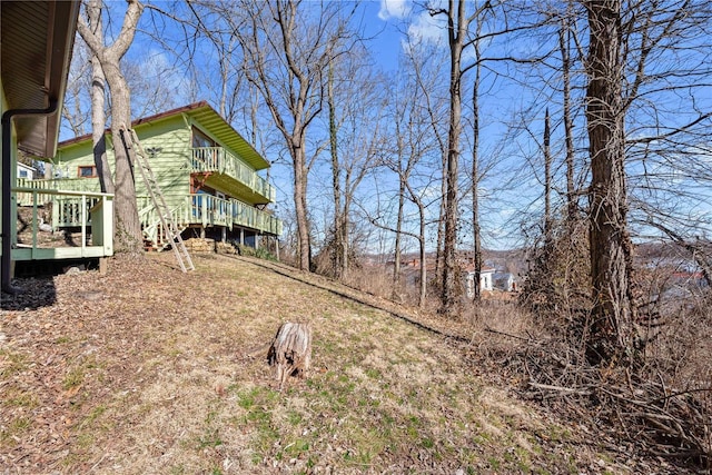 view of yard with a wooden deck