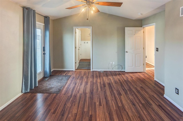 unfurnished bedroom featuring visible vents, baseboards, a ceiling fan, wood finished floors, and vaulted ceiling