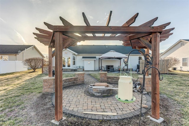 view of patio / terrace featuring an outdoor fire pit, fence, a pergola, and french doors