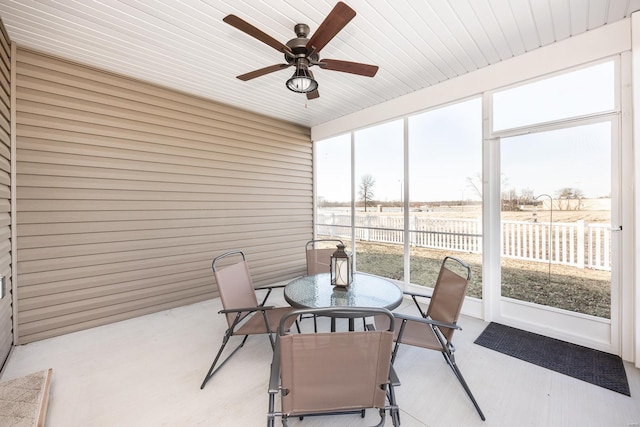 sunroom / solarium with ceiling fan