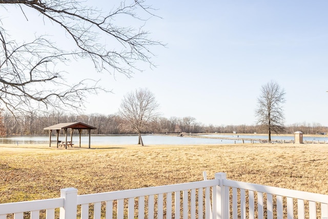 view of yard with a gazebo and a water view