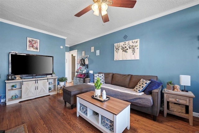 living area with ceiling fan, a textured ceiling, ornamental molding, and wood finished floors