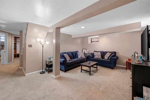 living room with recessed lighting, light carpet, and baseboards