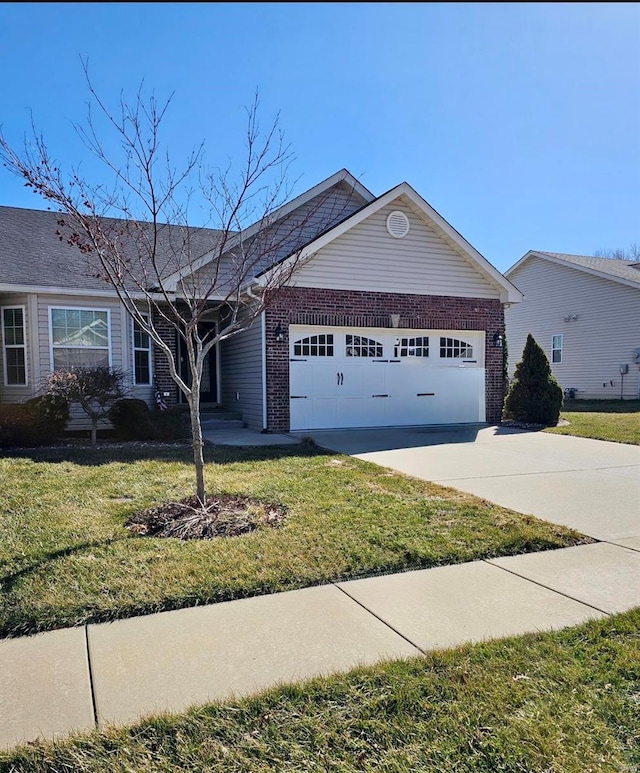 ranch-style house featuring a garage, concrete driveway, brick siding, and a front yard