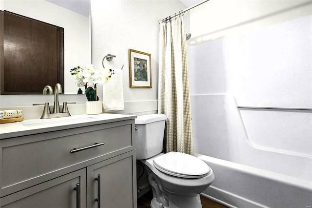 bathroom featuring shower / bath combo with shower curtain, vanity, and toilet