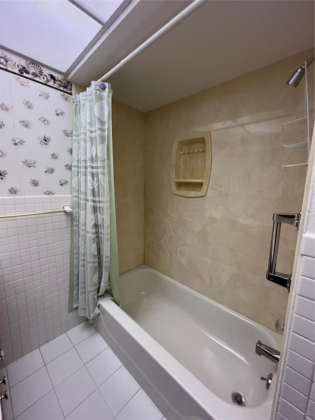 bathroom featuring shower / tub combo, tile patterned floors, wallpapered walls, and tile walls