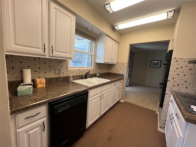 kitchen featuring dark countertops, a sink, white cabinetry, and black appliances
