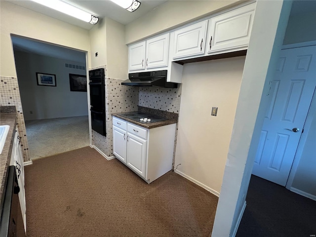 kitchen featuring dark carpet, white cabinetry, under cabinet range hood, and black appliances