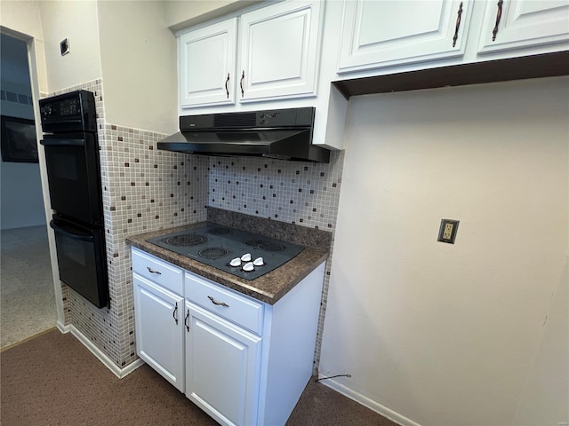 kitchen with under cabinet range hood, backsplash, dark countertops, black appliances, and white cabinetry