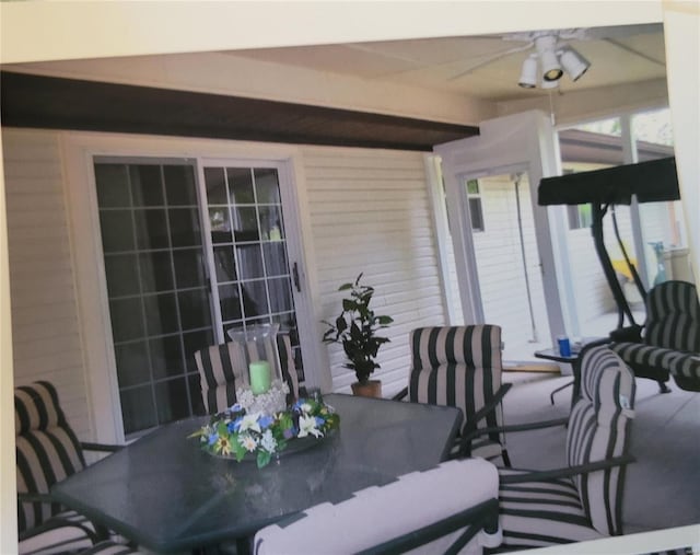 view of patio / terrace with a ceiling fan and outdoor dining area