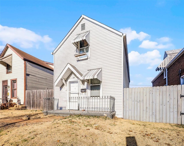 view of front of home with fence