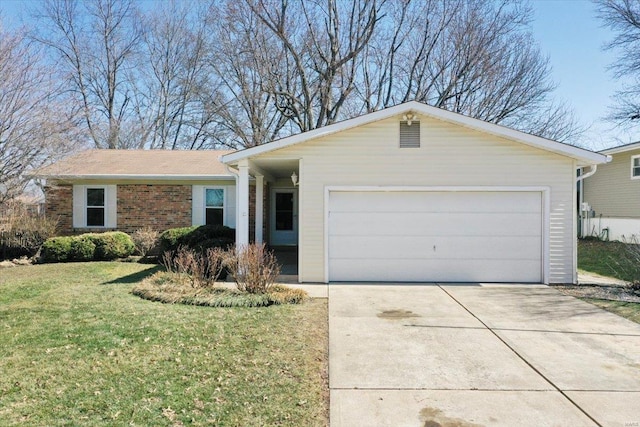 ranch-style home featuring a front yard, a garage, brick siding, and driveway