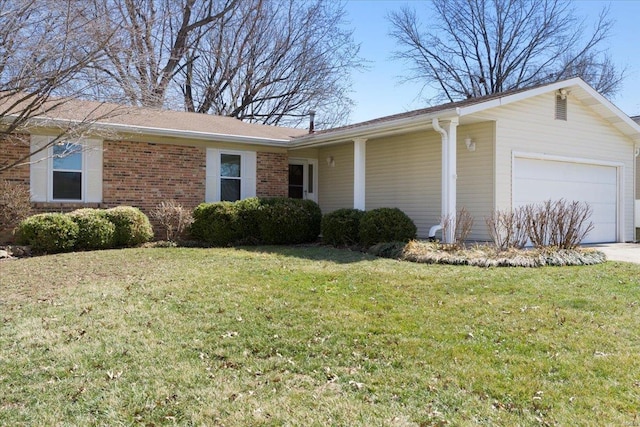 view of front of property featuring a front lawn, a garage, and brick siding