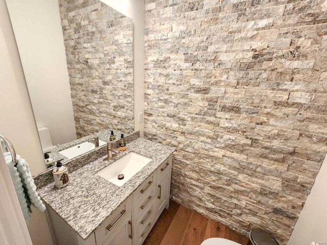 bathroom featuring vanity and wood finished floors