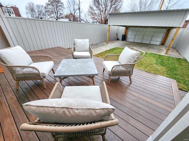 wooden deck featuring a fenced backyard and an outdoor hangout area