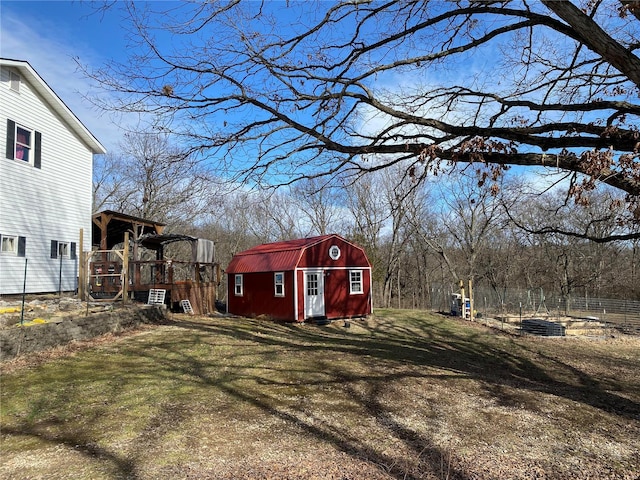 view of yard featuring a storage unit and an outbuilding