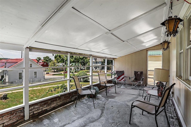 sunroom with lofted ceiling