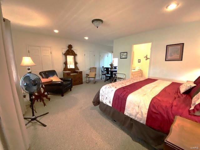 carpeted bedroom with recessed lighting