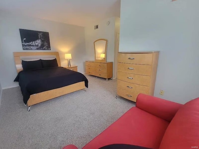 bedroom with light carpet and visible vents