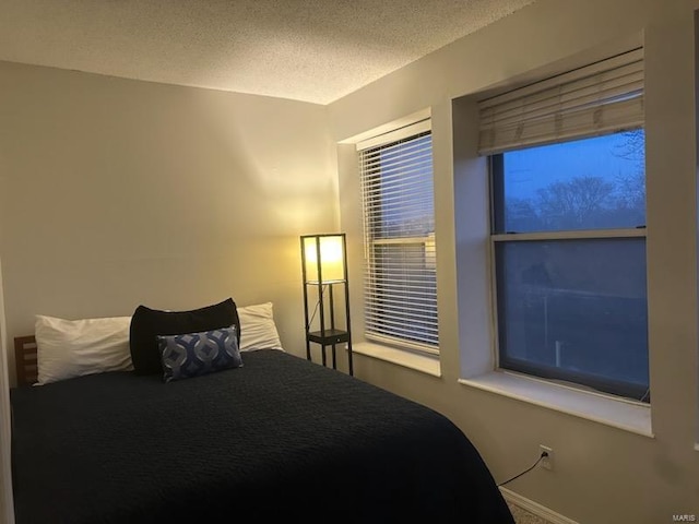 bedroom featuring a textured ceiling