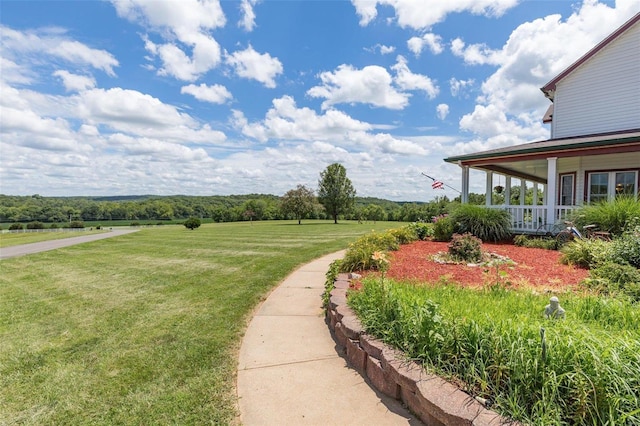 view of yard with covered porch