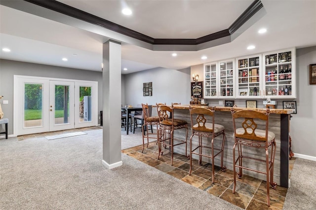 bar featuring ornamental molding, bar, recessed lighting, carpet flooring, and baseboards