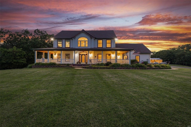 view of front of home with a porch and a front yard