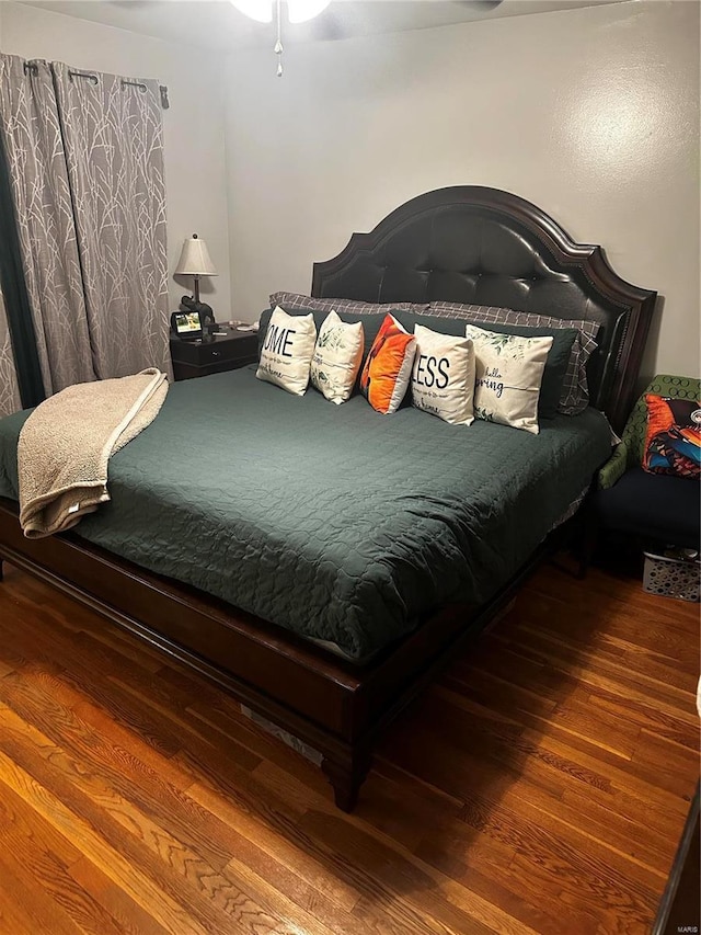 bedroom featuring wood finished floors