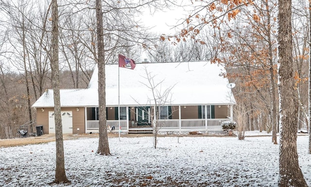 view of front facade with an attached garage and a porch