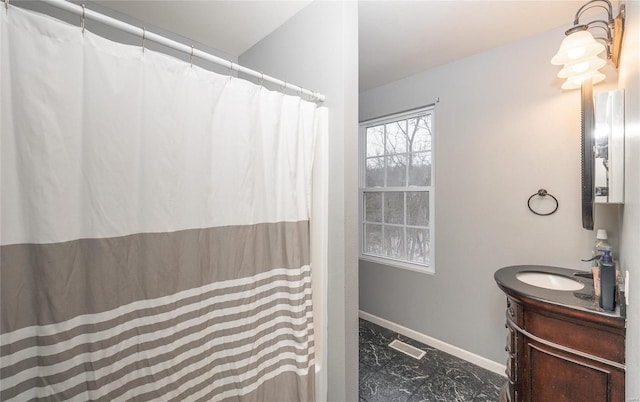 full bath featuring marble finish floor, a shower with curtain, baseboards, and vanity