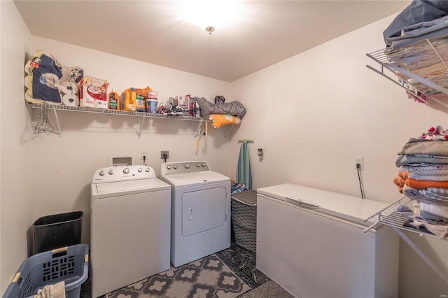 clothes washing area with laundry area and washer and clothes dryer