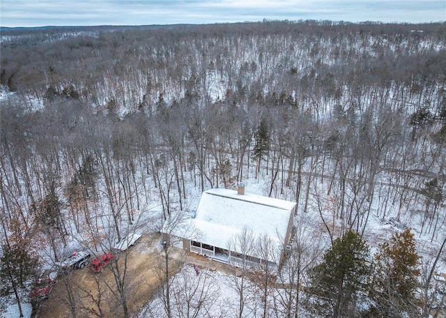 snowy aerial view with a forest view