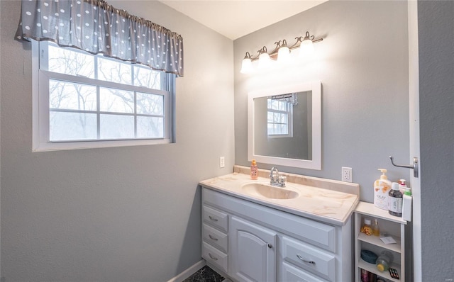bathroom with a wealth of natural light and vanity
