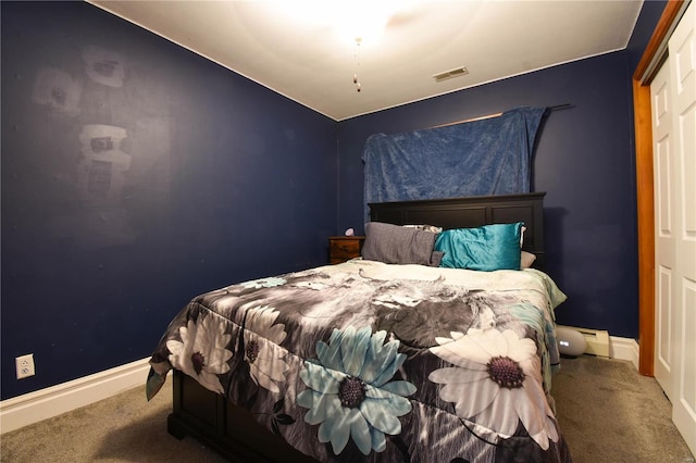 bedroom with visible vents, baseboards, and carpet