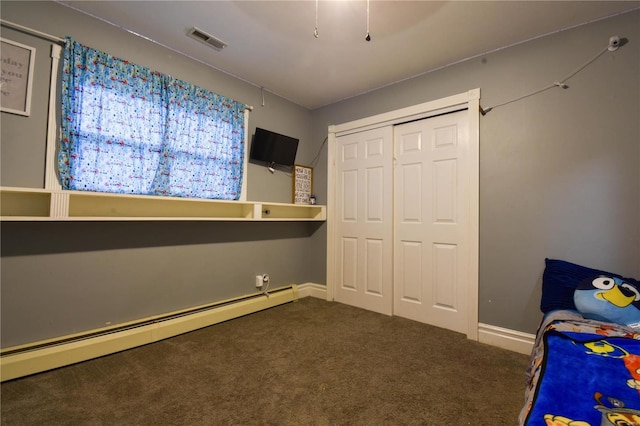 unfurnished bedroom featuring visible vents, a closet, carpet flooring, baseboards, and baseboard heating