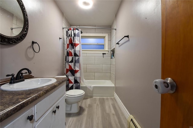 full bath with vanity, wood finished floors, shower / tub combo, toilet, and baseboard heating