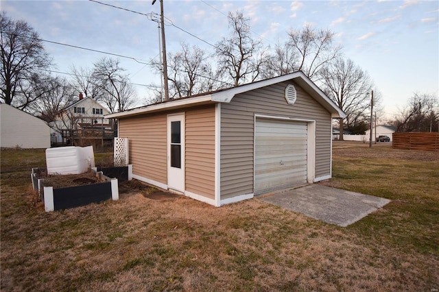 detached garage featuring driveway