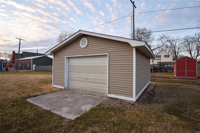 detached garage featuring driveway