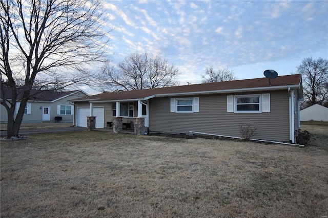 single story home with a front yard and an attached garage