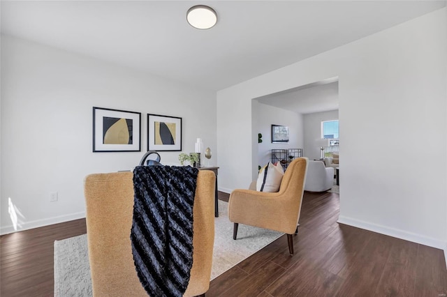 living room with dark wood finished floors and baseboards