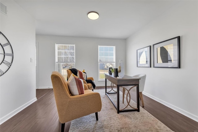 office space featuring visible vents, baseboards, and dark wood finished floors