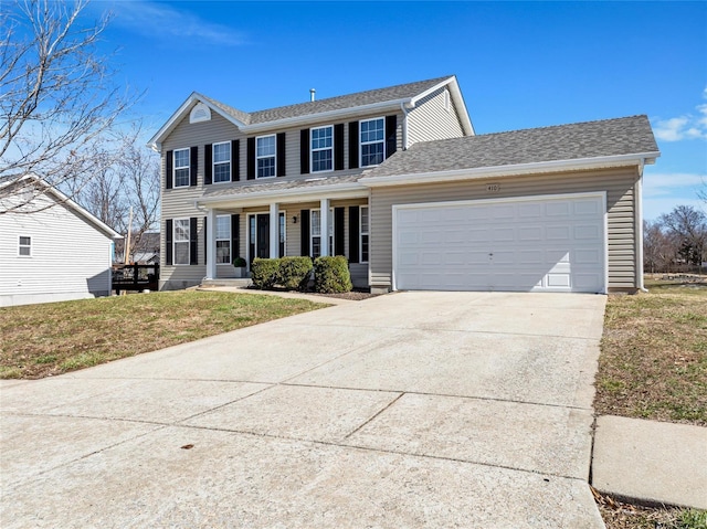 colonial house with a garage, concrete driveway, a front lawn, and a shingled roof