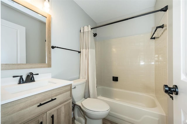 full bath featuring toilet, vanity, and shower / bath combo