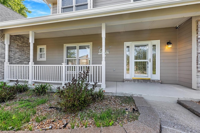 property entrance with covered porch