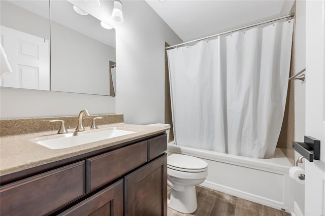 bathroom featuring shower / tub combo, vanity, toilet, and wood finished floors