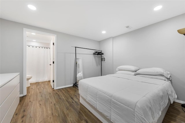 bedroom featuring wood finished floors, visible vents, and recessed lighting