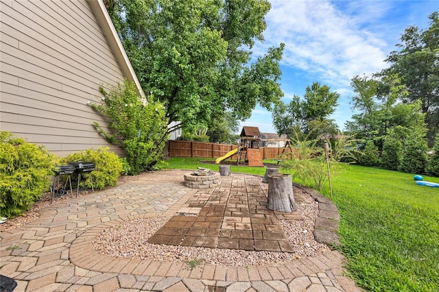 view of patio / terrace with fence and a playground