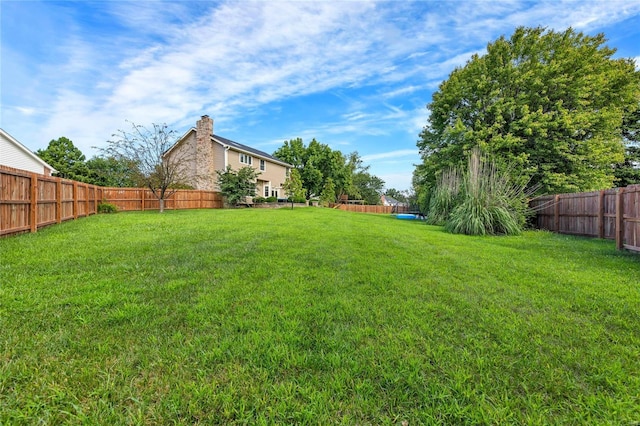 view of yard featuring a fenced backyard