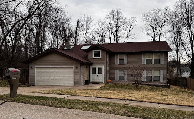 view of front of property featuring an attached garage, fence, concrete driveway, french doors, and a chimney