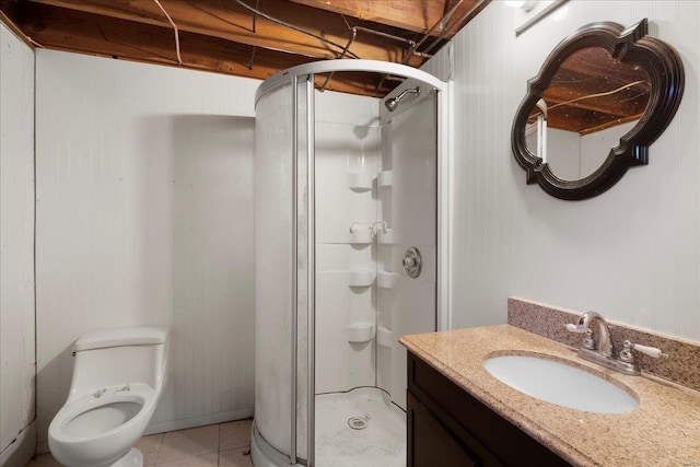 full bath featuring tile patterned flooring, toilet, a stall shower, and vanity